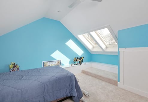arts and crafts style blue wall attic bedroom conversion in Narberth Borough by Bellweather Design Build