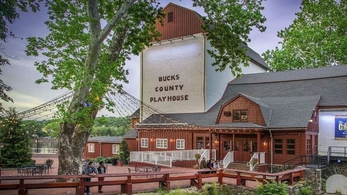 front of Bucks County Playhouse with tree in front and string lights in New hope Pennsylvania